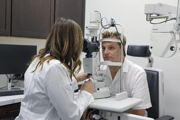 Dr. Melissa Dugan, OD conducts a slit-lamp examination to assess ocular health