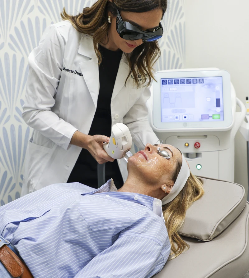 Dr. Melissa Dugan, OD a IPL treatment during an in-office eye care procedure.